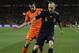 Spain's Andres Iniesta, right, and Netherlands' Robin van Persie, left during the World Cup final soccer match between the Netherlands and Spain at Soccer City in Johannesburg, South Africa, Sunday, July 11, 2010. (AP Photo/Martin Meissner)