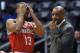 Milwaukee Bucks coach Larry Drew, right, calls in a play to Ramon Sessions (13) in the first half of an NBA basketball game against the Atlanta Hawks on Thursday, March 13, 2014, in Atlanta. (AP Photo/David Tulis)