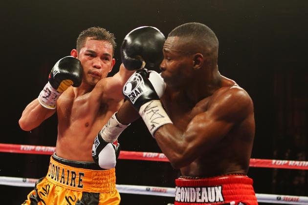 NEW YORK, NY - APRIL 13: Nonito Donaire punches Guillermo Rigondeaux during their WBO/WBA junior featherweight title unification bout at Radio City Music Hall on April 13, 2013 in New York City. (Photo by Al Bello/Getty Images)