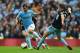 MANCHESTER, ENGLAND - MAY 11: Sergio Aguero of Manchester City is challenged by George McCartney of West Ham United during the Barclays Premier League match between Manchester City and West Ham United at the Etihad Stadium on May 11, 2014 in Manchester, England. (Photo by Shaun Botterill/Getty Images)