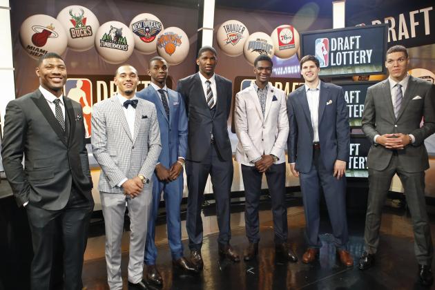 From left, NBA draft prospects Marcus Smart of Oklahoma State, Tyler Ennis of Syracuse, Andrew Wiggins and Joel Embiid of Kansas, Noah Vonleh of Indiana, Doug McDermott of Creighton and Aaron Gordon of Arizona pose for a photograph before the NBA basketball draft lottery in New York, Tuesday, May 20, 2014. (AP Photo/Kathy Willens)