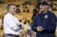 Arizona's head coach Rich Rodriguez, right, talks with Arizona State's head coach Todd Graham prior to an NCAA college football game Saturday, Nov. 30, 2013, in Tempe, Ariz. Arizona State defeated Arizona 58-21. (AP Photo/Ross D. Franklin)
