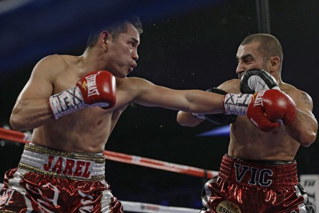 Nonito Donaire, left, lands a punch on Vic Darchinyan during round 4 of their featherweight rematch, Saturday, Nov. 9, 2013, in Corpus Christi, Texas. (AP Photo/Eric Gay)