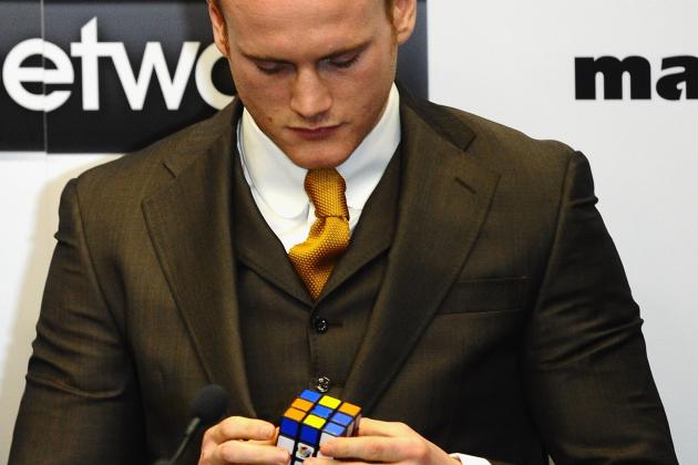 LONDON, ENGLAND - MARCH 10: Boxer George Groves plays with a Rubik's Cube as Carl Froch speaks during a Press Conference at Wembley Stadium on March 10, 2014 in London, England.  (Photo by Laurence Griffiths/Getty Images)
