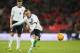 England's Wayne Rooney takes a direct free kick watched by teammate Steven Gerrard during the international friendly soccer match between England and Denmark at Wembley stadium in London Wednesday, March 5, 2014. (AP Photo/Alastair Grant)