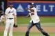 May 27, 2014; New York, NY, USA; New York Mets starting pitcher Jonathon Niese (49) looks on as recording artist 50 Cent throws out the ceremonial first pitch prior to the game against the Pittsburgh Pirates at Citi Field. Mandatory Credit: William Perlman/THE STAR-LEDGER via USA TODAY Sports