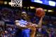 INDIANAPOLIS, IN - MARCH 30: Julius Randle #30 of the Kentucky Wildcats shoots the ball over Jordan Morgan #52 of the Michigan Wolverines in the first half during the midwest regional final of the 2014 NCAA Men's Basketball Tournament at Lucas Oil Stadium on March 30, 2014 in Indianapolis, Indiana. (Photo by Andy Lyons/Getty Images)