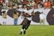 TAMPA, FL - SEPTEMBER 15: Running back Doug Martin #22 of the Tampa Bay Buccaneers rushes upfield in the 4th quarter against the New Orleans Saints September 15, 2013 at Raymond James Stadium in Tampa, Florida. The Saints won 16 - 14. (Photo by Al Messerschmidt/Getty Images)