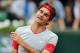 Switzerland's Roger Federer reacts as he plays Latvia's Ernests Gulbis during their fourth round match of the French Open tennis tournament at the Roland Garros stadium, in Paris, France, Sunday, June 1, 2014. (AP Photo/David Vincent)