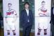 Coach of German national soccer team Joachim Loew stands next to pictures of players Philipp Lahm, left, and Miroslav Klose after a press conference where he presented his preliminary team for the upcoming World Cup in Brazil in Frankfurt, Germany, Thursday, May 8, 2014. (AP Photo/Michael Probst)