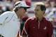 FILE - In this file photo taken Oct. 9, 2010, Alabama coach Nick Saban, right, talks with South Carolina coach Steve Spurrier before the start of an NCAA college football game in Columbia, S.C. Spurrier has a plan to pay players, and it wouldn't cost schools or conferences a dime. South Carolina's head ball coach offered an interesting yet far-from-feasible proposal Wednesday, June 1, 2011, that would give 70 players $300 every game for expenses. (AP Photo/Mary Ann Chastain, File)