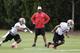 Tampa Bay Buccaneers head coach Lovie Smith, center, watches wide receivers Sky Dawson, left, and Eric Page, right, during a Buccaneers minicamp voluntary NFL football practice Tuesday, April 22, 2014, in Tampa, Fla. (AP Photo/Chris O'Meara)