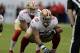 San Francisco 49ers quarterback Colin Kaepernick (7) takes the snap from center Jonathan Goodwin (59) during the fourth quarter of an NFL football game against the Tampa Bay Buccaneers Sunday, Dec. 15, 2013, in Tampa, Fla. (AP Photo/Chris O'Meara)