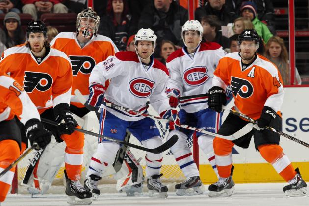PHILADELPHIA, PA - DECEMBER 12: Braydon Coburn #5, Steve Mason #35, and Kimmo Timonen #44 of the Philadelphia Flyers watch the play at the top of the zone while defending against David Desharnais #51 and Daniel Briere #48 of the Montreal Canadiens on December 12, 2013 at the Wells Fargo Center in Philadelphia, Pennsylvania.  (Photo by Len Redkoles/NHLI via Getty Images)