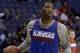 Kansas center Joel Embiid dribbles during practice for the NCAA college basketball tournament Thursday, March 20, 2014, in St. Louis. Kansas is scheduled to play Eastern Kentucky in a second-round game on Friday. (AP Photo/Jeff Roberson)