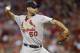 St. Louis Cardinals starting pitcher Adam Wainwright throws against the Cincinnati Reds in the third inning of a baseball game, Sunday, May 25, 2014, in Cincinnati. (AP Photo/Al Behrman)