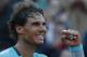 Spain's Rafael Nadal celebrates winning the quarterfinal match of the French Open tennis tournament against compatriot David Ferrer at the Roland Garros stadium, in Paris, France, Wednesday, June 4, 2014. Nadal won in four sets 4-6, 6-4, 6-0, 6-1. (AP Photo/Michel Euler)