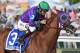 BALTIMORE, MD - MAY 17: California Chrome #3, ridden by Victor Espinoza, races to the finishline to win the 139th running of the Preakness Stakes at Pimlico Race Course on May 17, 2014 in Baltimore, Maryland. (Photo by Molly Riley/Getty Images)