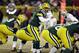 Green Bay Packers quarterback Aaron Rodgers (12) calls a play during the second half of an NFL wild-card playoff football game against the San Francisco 49ers, Sunday, Jan. 5, 2014, in Green Bay, Wis. (AP Photo/Mike Roemer)