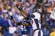 INDIANAPOLIS, IN - OCTOBER 20: Julius Thomas #80 of the Denver Broncos catches a touchdown pass in front of Antoine Bethea #41 of the Indianapolis Colts at Lucas Oil Stadium on October 20, 2013 in Indianapolis, Indiana. (Photo by Andy Lyons/Getty Images)