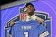North Carolina tight end Eric Ebron poses for photos after being selected by the Detroit Lions as the 10th pick in the first round of the 2014 NFL Draft, Thursday, May 8, 2014, in New York. (AP Photo/Craig Ruttle)