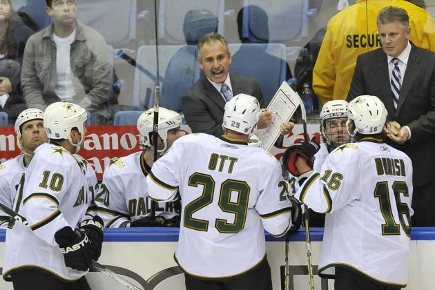 Dallas Stars Assistant Coach Willie Desjardins talks to players as Head Coach Marc Crawford listens at right during an NHL hockey game against the New York Islanders Saturday, Oct. 9, 2010, in Uniondale, New York. (AP Photo/Kathy Kmonicek)
