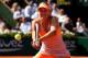 PARIS, FRANCE - JUNE 05: Maria Sharapova of Russia returns a shot during her women's singles semi-final match against Eugenie Bouchard of Canada on day twelve of the French Open at Roland Garros on June 5, 2014 in Paris, France. (Photo by Matthew Stockman/Getty Images)