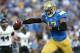 PASADENA, CA - NOVEMBER 02: Quarterback Brett Hundley #17 of the UCLA Bruins holds out the ball as he scores on an 11 yard touchdown run in the second quarter against the Colorado Buffaloes at the Rose Bowl on November 2, 2013 in Pasadena, California. (Photo by Stephen Dunn/Getty Images)