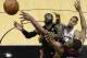Miami Heat's LeBron James (6), Chris Bosh (1) and San Antonio Spurs' Tim Duncan go after a loose ball during the second half at Game 5 of the NBA Finals basketball series, Sunday, June 16, 2013, in San Antonio. The Spurs won 114-104. (AP Photo/John G. Mabanglo, Pool)
