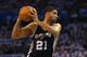 OKLAHOMA CITY, OK - MAY 31: Tim Duncan #21 of the San Antono Spurs looks to pass the ball against the Oklahoma City Thunder in the first half during Game Six of the Western Conference Finals of the 2014 NBA Playoffs at Chesapeake Energy Arena on May 31, 2014 in Oklahoma City, Oklahoma. NOTE TO USER: User expressly acknowledges and agrees that, by downloading and or using this photograph, User is consenting to the terms and conditions of the Getty Images License Agreement. (Photo by Ronald Martinez/Getty Images)