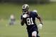 St. Louis Rams wide receiver Kenny Britt runs with the ball during an organized team activity at the NFL football team's practice facility Thursday, June 5, 2014, in St. Louis. (AP Photo/Jeff Roberson)