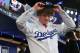 SECAUCUS, NJ - JUNE 5: Grant Holmes puts on his Los Angeles Dodgers cap after being selected 22nd overall during the MLB First-Year Player Draft at the MLB Network Studio on June 5, 2014 in Secacucus, New Jersey. (Photo by Rich Schultz/Getty Images)