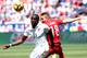 HARRISON, NJ - JUNE 01: Jozy Altidore #17 of United States and Caner Erkin #18 of Turkey fight for the ball in the first half during an international friendly match at Red Bull Arena on June 1, 2014 in Harrison, New Jersey. (Photo by Elsa/Getty Images)