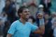 Spain's Rafael Nadal celebrates winning the quarterfinal match of the French Open tennis tournament against compatriot David Ferrer at the Roland Garros stadium, in Paris, France, Wednesday, June 4, 2014. Nadal won in four sets 4-6, 6-4, 6-0, 6-1. (AP Photo/Michel Euler)