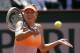 Russia's Maria Sharapova returns the ball to Canada's Eugenie Bouchard during their semifinal match of the French Open tennis tournament at the Roland Garros stadium, in Paris, France, Thursday, June 5, 2014. (AP Photo/Darko Vojinovic)