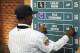 Shortstop Nick Gordon from Olympia high school in Windemere, Florida puts his name onto the board after being selected by the Minnesota Twins with the fifth pick in the 2014 MLB baseball draft Thursday, June 5, 2014, in Secaucus, N.J. (AP Photo/Bill Kostroun)
