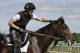 Exercise rider Chris Davis strokes Belmont Stakes entrant Medal Count's mane before a workout at Belmont Park, Friday, June 6, 2014, in Elmont, N.Y. Medal Count will be one of ten challengers looking to spoil California Chrome's bid at a Triple Crown when they race in the 146th running of the Belmont Stakes horse race on Saturday. (AP Photo/Garry Jones)