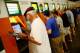 ELMONT, NY - JUNE 07: Fans place bets prior to the Belmont Stakes at Belmont Park on June 7, 2014 in Elmont, New York. (Photo by Streeter Lecka/Getty Images)