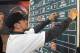 Shortstop Michael Chavis from Sprayberry Senior High School in Marietta, Georgia, posts his name on the board at the 2014 MLB baseball draft Thursday, June 5, 2014, in Secaucus, N.J. Chavis was selected by the Boston Red Sox with the 26th pick in the first round. (AP Photo/Bill Kostroun)