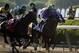 Jun 7, 2014; Elmont, NY, USA; Victor Espinoza aboard California Chrome (2) down the front stretch during the 2014 Belmont Stakes at Belmont Park. California Chrome finished 4th. Mandatory Credit: Robert Deutsch-USA TODAY Sports