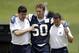 Dallas Cowboys linebacker Sean Lee is helped off the field by head athletic trainer Jim Maurer, left, and associate athletic trainer Britt Brown, right, after suffering an unknown left leg injury during an NFL football organized team activity, Tuesday, May 27, 2014, in Irving, Texas. (AP Photo/Tony Gutierrez)