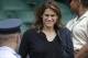 Retired tennis player Amelie Mauresmo arrives to watch Marion Bartoli of France face Kirsten Flipkens of Belgium in a Women's singles semifinal match at the All England Lawn Tennis Championships in Wimbledon, London, Thursday, July 4, 2013. (AP Photo/Anja Niedringhaus)