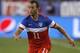 U.S. midfielder Brad Davis (11) carries the ball against Mexico during the second half of an international friendly soccer match Wednesday, April 2, 2014, in Glendale, Ariz. The game ended in a 2-2 draw. (AP Photo/Rock Scuteri)