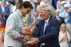 Spain's Rafael Nadal, left, gets the cup from Swedish tennis legend Bjorn Borg after defeating Serbia's Novak Djokovic in their final match of the French Open tennis tournament at the Roland Garros stadium, in Paris, France, Sunday, June 8, 2014. Nadal won 3-6, 7-5, 6-2, 6-4. (AP Photo/Michel Euler)