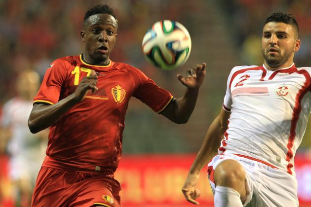 Tunisia's Syam Ben Youssef, right, is challenged by Belgium's Divock Origi during a friendly soccer match at the King Baudouin stadium in Brussels, Saturday, June 7, 2014. Belgium will play against South Korea, Russia and Algeria in Group H of the World Cup 2014 in Brazil. (AP Photo/Yves Logghe)