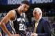 DALLAS, TX - APRIL 26: Gregg Popovich of the San Antonio Spurs talks to Tim Duncan #21 during the game against the Dallas Mavericks during Game Three of the Western Conference Quarterfinals during the 2014 NBA Playoffs on April 26, 2014 at the American Airlines Center in Dallas, Texas. NOTE TO USER: User expressly acknowledges and agrees that, by downloading and/or using this Photograph, user is consenting to the terms and conditions of the Getty Images License Agreement. Mandatory Copyright Notice: Copyright 2013 NBAE (Photo by Glenn James/NBAE via Getty Images)
