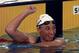 American Amy van Dyken reacts after finishing her heat in the women's 100 meter butterfly at the 1996 Summer Olympics in Atlanta, Tuesday, July 23, 1996. (AP Photo/Doug Mills)