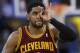 Cleveland Cavaliers guard Kyrie Irving celebrates after making a three-point basket against the Golden State Warriors during the second half of an NBA basketball game on Friday, March 14, 2014, in Oakland, Calif. Cleveland won 103-94. (AP Photo/Marcio Jose Sanchez)