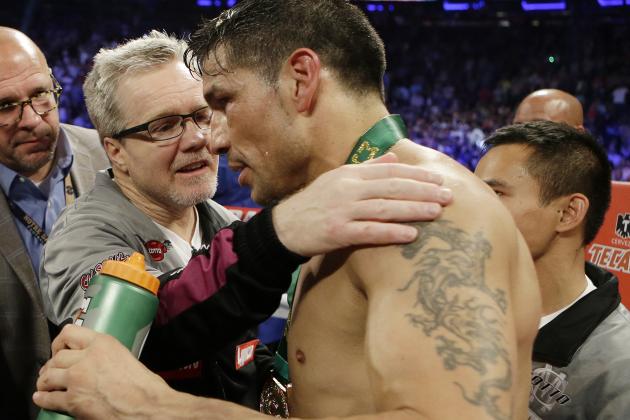 Trainer Freddie Roach talks with Sergio Martinez, of Argentina, after a WBC World Middleweight Title boxing match against Miguel Cotto, of Puerto Rico, Sunday, June 8, 2014, in New York.  Cotto won the fight. (AP Photo/Frank Franklin II)