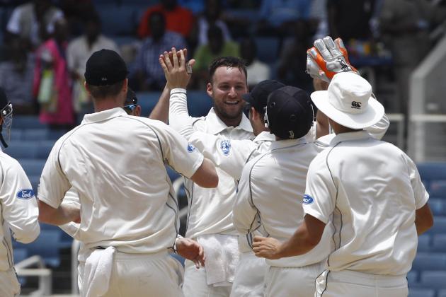 New Zealand's bowler Mark Craig, center facing camera, celebrates with teammates after taking the wicket of West Indies Kirk Edwards who was caught by New Zealand's Ross Taylor for a duck during the third day of their first cricket Test match in Kingston, Jamaica, Tuesday, June 10, 2014. (AP Photo/Arnulfo Franco)